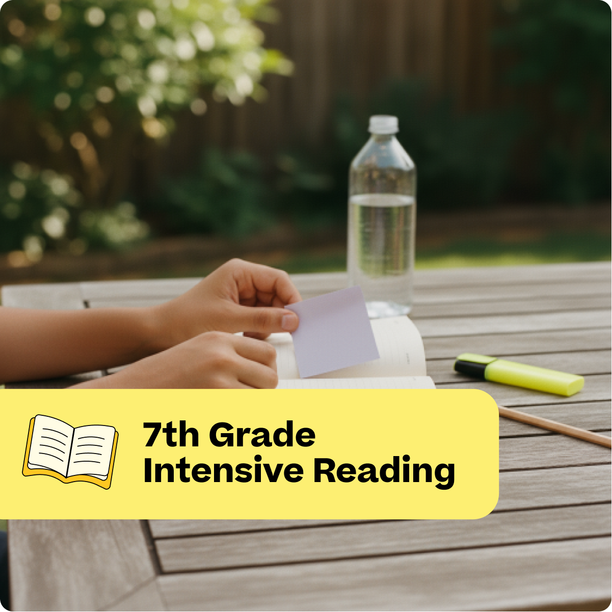 Person reading a book outdoors with a water bottle and highlighter on a wooden table.