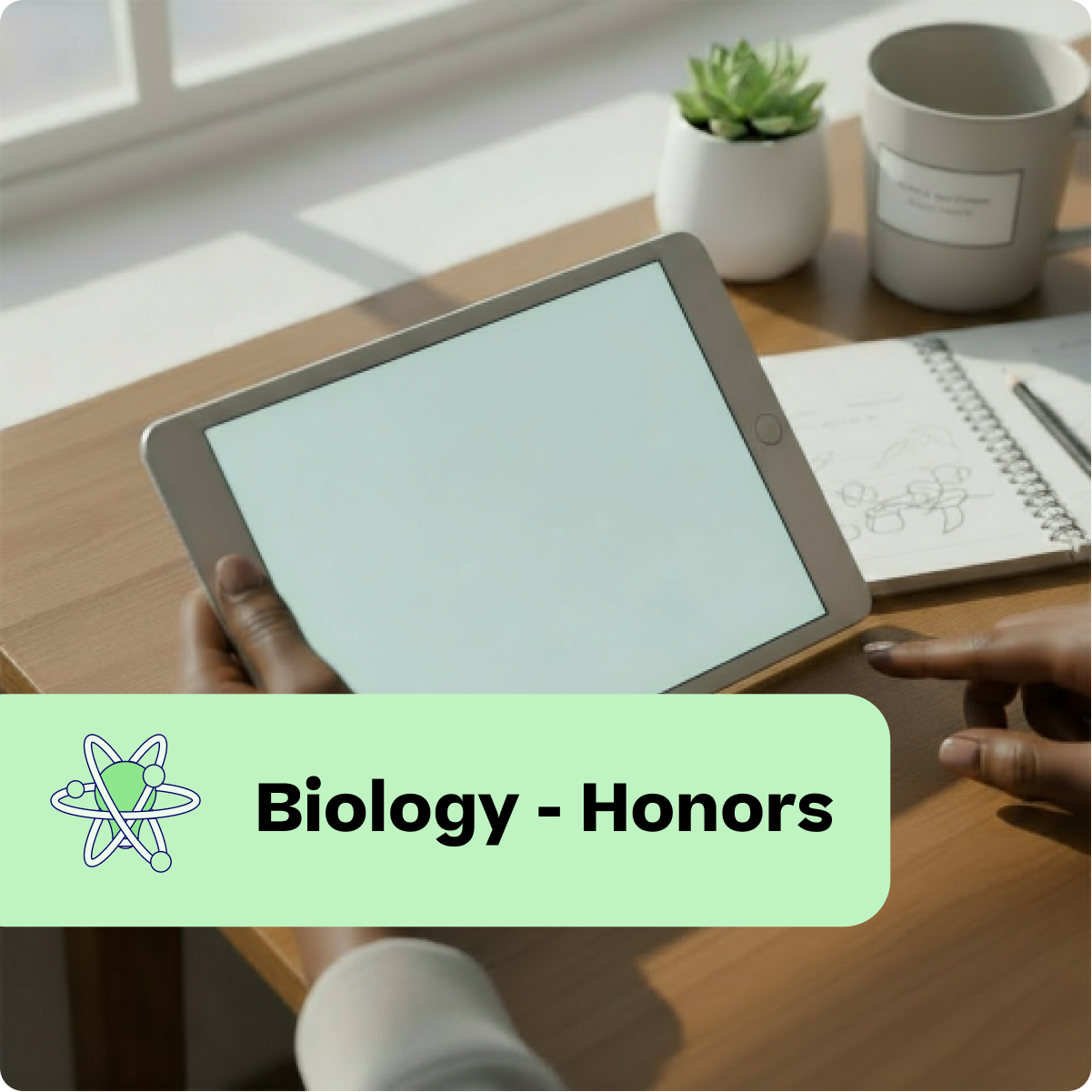 Person holding a tablet with 'Biology - Honors' text and atom icon on a desk.