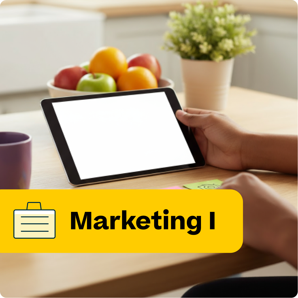 Person using a tablet on a table with fruits and a plant, labeled 'Marketing I'.