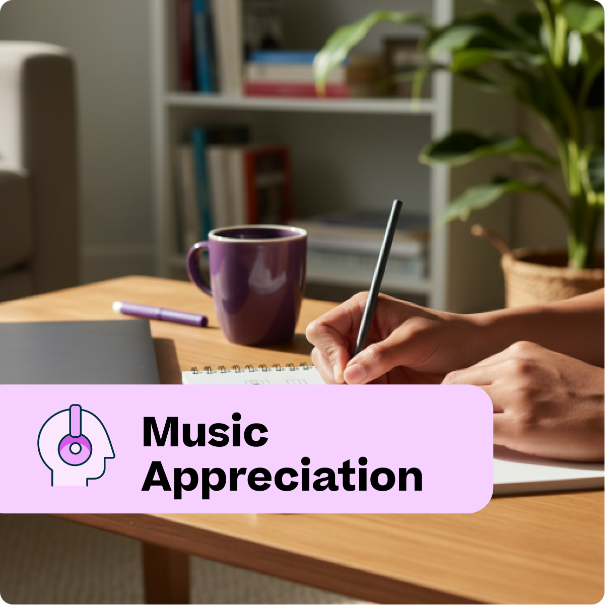Person writing in a notebook with a mug and tablet on a table, labeled 'Music Appreciation'.