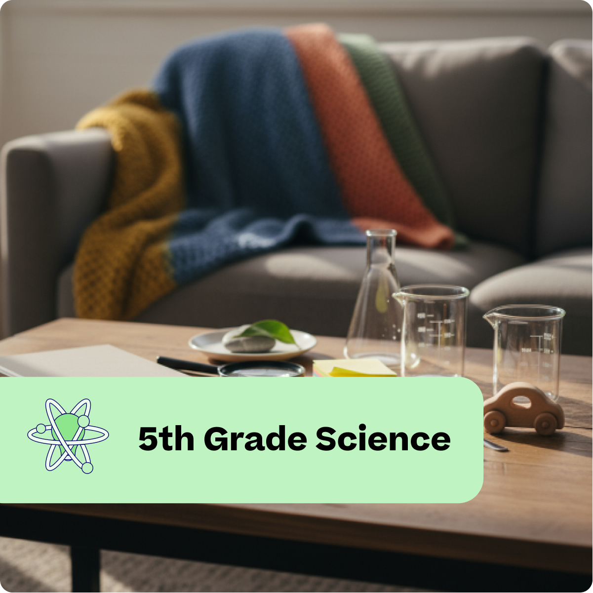 Living room with a couch, coffee table, and science-themed decor including beakers and a leaf.