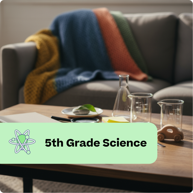 Living room with a couch, coffee table, and science-themed decor including beakers and a leaf.