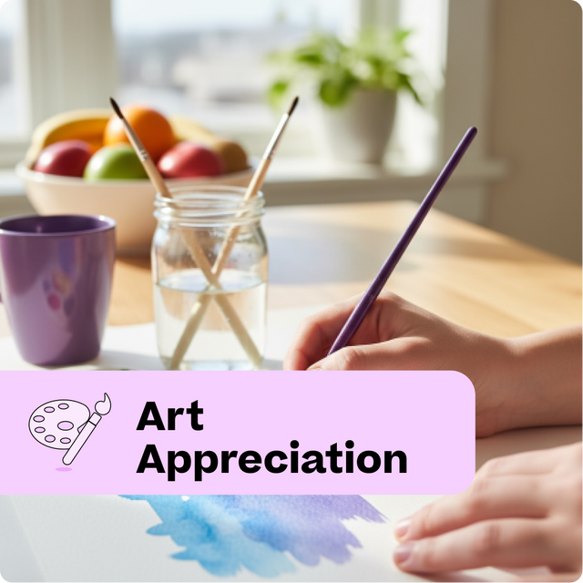 Person painting with watercolors on a table with a bowl of fruit and a cup in the background.