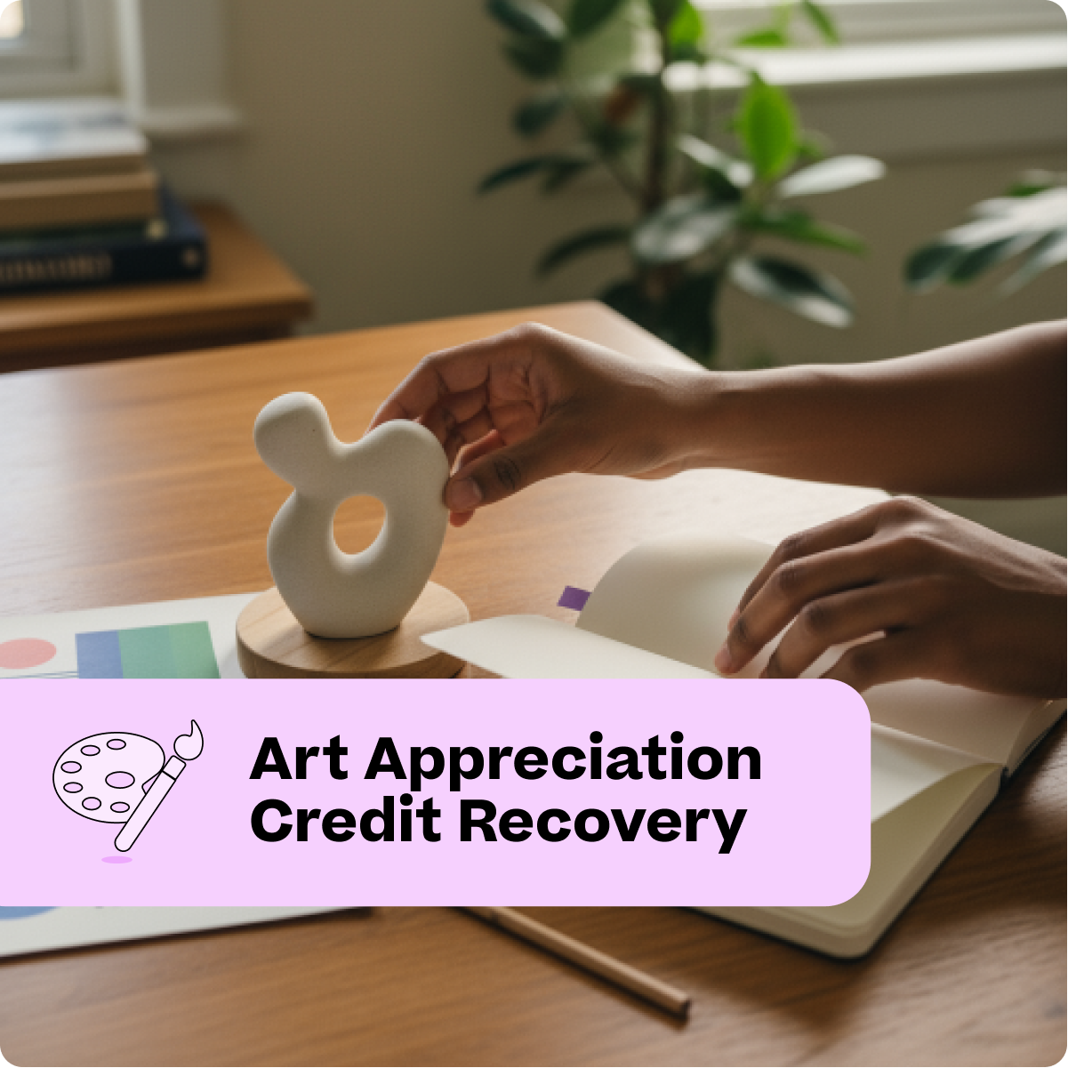 Person holding a small white sculpture on a wooden table with books and a plant in the background.