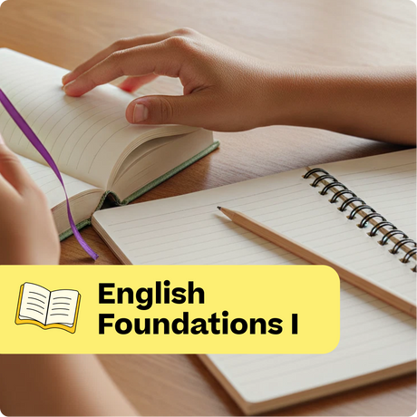 Open book with a hand on a wooden surface, next to a notebook and pencil, with 'English Foundations I' text overlay.