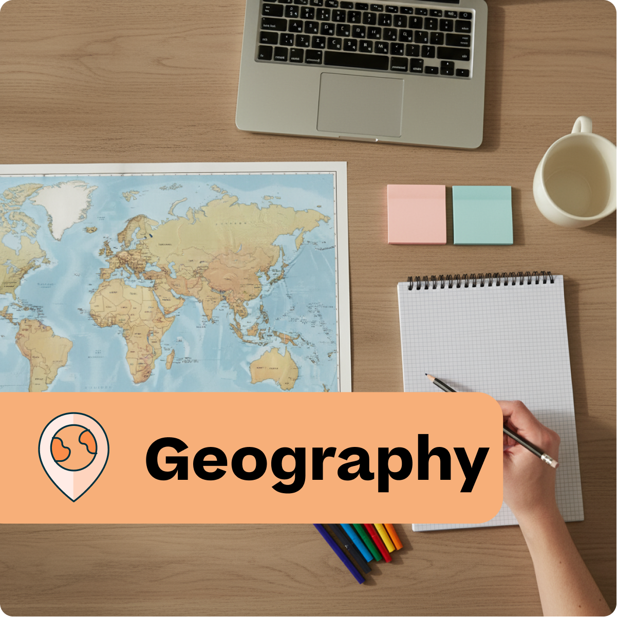 Desk with world map, laptop, notebook, and colorful pencils with 'Geography' label.
