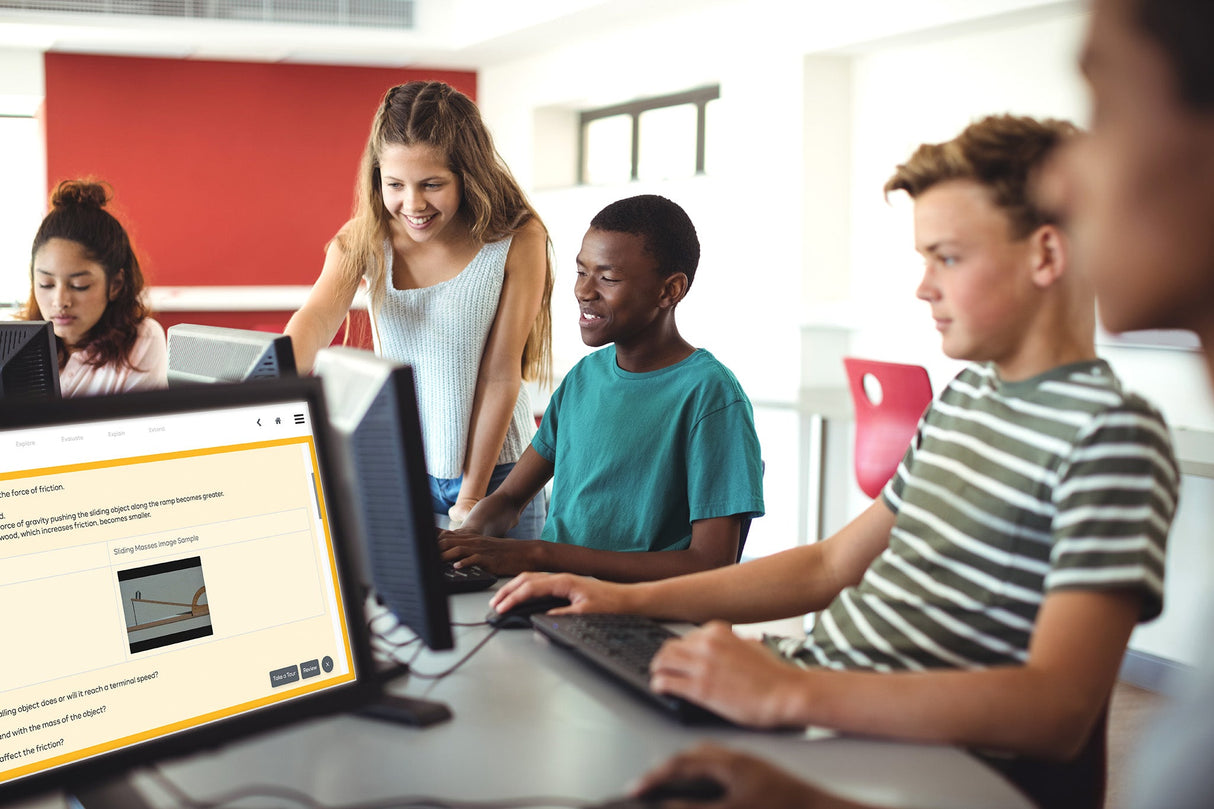 Group of students working on computers in a classroom setting